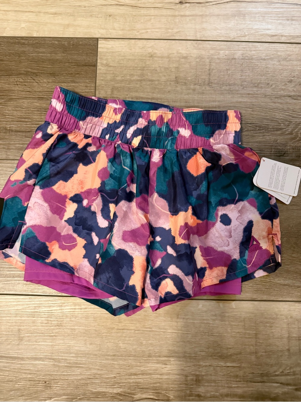 Reebok Women’s Multicolor Abstract Athletic Shorts — Purple, Pink, Teal, Navy